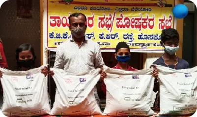  Families holding ration kits received during a community food support initiative 